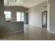 Open-concept living room with tile flooring, ceiling fan, and sliding door access to the backyard at 4402 E Creosote Dr, Cave Creek, AZ 85331