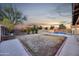 Large backyard featuring a pool, patio and a spacious lawn for outdoor recreation and entertainment at 446 W Sereno Dr, Gilbert, AZ 85233