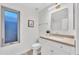Fresh bathroom featuring modern vanity, updated lighting, and frosted window at 446 W Sereno Dr, Gilbert, AZ 85233
