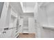 Walk-in closet with built-in shelves and hanging rods, providing ample storage space at 446 W Sereno Dr, Gilbert, AZ 85233