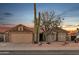 Charming single-story home with desert landscaping and a two-car garage under a beautiful sunset sky at 446 W Sereno Dr, Gilbert, AZ 85233