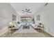 Bright living room with white sofas, neutral rug, and a view to the backyard with a beautiful desert sunset at 446 W Sereno Dr, Gilbert, AZ 85233