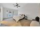 Bright main bedroom with french door access to the pool and neutral carpeting at 446 W Sereno Dr, Gilbert, AZ 85233