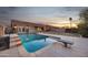 Backyard pool perfect for relaxation, complete with diving board and ample patio space at 446 W Sereno Dr, Gilbert, AZ 85233