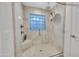 Glass enclosed shower with unique glass block window and updated fixtures at 446 W Sereno Dr, Gilbert, AZ 85233