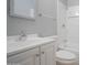 This bathroom features a white vanity, toilet, and shower/bath with white tile and chrome fixtures at 4719 E Belleview St, Phoenix, AZ 85008
