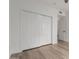 Bedroom with laminate flooring and a closet with white sliding doors at 501 E 2Nd Ave # 14, Mesa, AZ 85204