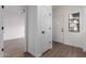 Bright entryway featuring wood-look flooring, and white doors at 501 E 2Nd Ave # 14, Mesa, AZ 85204