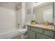 Classic bathroom featuring a shower-tub combination, tiled walls and a stone vanity at 5808 E Brown Rd # 106, Mesa, AZ 85205