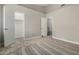 Bright bedroom with neutral carpet, walk-in closet, and vaulted ceiling detail at 5808 E Brown Rd # 106, Mesa, AZ 85205