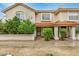 Charming townhome featuring a red tile roof, stucco siding, and well-maintained landscaping at 5808 E Brown Rd # 106, Mesa, AZ 85205