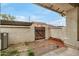 Enclosed patio area featuring brickwork, stucco walls, and potential for outdoor enjoyment at 5808 E Brown Rd # 106, Mesa, AZ 85205