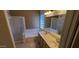 Bathroom with soaking tub, double vanity, and tiled flooring and shower at 6005 E Selkirk Cir, Mesa, AZ 85215