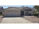 Charming single-story home with a two-car garage and meticulously maintained desert landscaping at 6005 E Selkirk Cir, Mesa, AZ 85215
