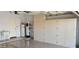 Garage with epoxy floors, water heater and storage cabinets at 6005 E Selkirk Cir, Mesa, AZ 85215