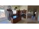 Well-lit kitchen featuring an island, stainless steel appliances, and tile backsplash at 6005 E Selkirk Cir, Mesa, AZ 85215