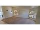 Bright living room featuring vaulted ceiling, carpet flooring, and a bay of windows at 6005 E Selkirk Cir, Mesa, AZ 85215