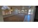 Bright living room with carpet flooring and windows providing natural light at 6005 E Selkirk Cir, Mesa, AZ 85215