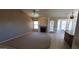 Open-concept living room with a fireplace and adjacent kitchen and dining area at 6005 E Selkirk Cir, Mesa, AZ 85215