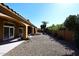 Backyard showcasing desert landscaping, covered patio, and a private outdoor space at 6323 E Nisbet Rd, Scottsdale, AZ 85254