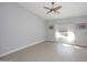 Bedroom featuring hardwood floors, ceiling fan, and window with bright sunlight at 6323 E Nisbet Rd, Scottsdale, AZ 85254