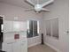 Dining area with white cabinets and drawers, a modern ceiling fan, and natural light at 6323 E Nisbet Rd, Scottsdale, AZ 85254