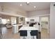 Open concept kitchen featuring white countertops, an island with seating, and stainless appliances at 6323 E Nisbet Rd, Scottsdale, AZ 85254
