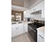 Bright kitchen with stainless steel appliances, white cabinets, and quartz countertops at 6323 E Nisbet Rd, Scottsdale, AZ 85254