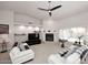 Spacious living room featuring neutral colors, vaulted ceilings, fireplace, and plenty of natural light at 6323 E Nisbet Rd, Scottsdale, AZ 85254