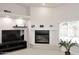 Living room featuring a fireplace, neutral paint, and tile flooring, creating a cozy and inviting atmosphere at 6323 E Nisbet Rd, Scottsdale, AZ 85254
