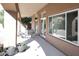 Covered patio with desert landscaping visible through the windows and sliding glass doors at 6323 E Nisbet Rd, Scottsdale, AZ 85254