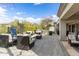 Beautiful backyard featuring multiple seating areas, a built-in grill, and lush greenery for ultimate relaxation at 6340 E Marioca Cir, Scottsdale, AZ 85266