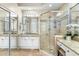 Bright bathroom with glass shower, double mirrors, granite counters and tile flooring at 6340 E Marioca Cir, Scottsdale, AZ 85266