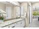 A bright bathroom space with a vanity and views of the outside at 6340 E Marioca Cir, Scottsdale, AZ 85266