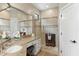 Stylish bathroom with a spacious glass shower, granite counters and modern fixtures at 6340 E Marioca Cir, Scottsdale, AZ 85266