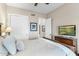 Comfortable bedroom featuring a ceiling fan, closet, and doorway leading to another room at 6340 E Marioca Cir, Scottsdale, AZ 85266