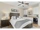 Cozy bedroom with a king bed, ceiling fan, and wet bar with a wine fridge at 6340 E Marioca Cir, Scottsdale, AZ 85266