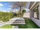 Backyard showcases a modern hot tub surrounded by lush landscaping and a sleek design, perfect for relaxation at 6340 E Marioca Cir, Scottsdale, AZ 85266