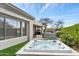 Inviting backyard features a luxurious hot tub, outdoor kitchen with grill, and covered patio for relaxation and entertaining at 6340 E Marioca Cir, Scottsdale, AZ 85266