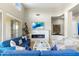 Cozy living room with a modern fireplace, comfortable seating, and bright lighting at 6340 E Marioca Cir, Scottsdale, AZ 85266