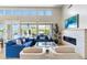 Comfortable living room with fireplace, modern décor, large windows offering natural light and views at 6340 E Marioca Cir, Scottsdale, AZ 85266