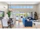 Bright living room and dining area with large windows, tile floors, and modern decor at 6340 E Marioca Cir, Scottsdale, AZ 85266