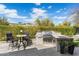 Beautifully designed outdoor kitchen with a built-in grill and bar area, ideal for entertaining in style at 6340 E Marioca Cir, Scottsdale, AZ 85266