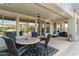 Covered patio featuring an outdoor dining area and access to an outdoor seating area for relaxation at 6340 E Marioca Cir, Scottsdale, AZ 85266