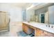 Bright bathroom with a double vanity, soaking tub, and separate shower at 6920 W Tether Trl, Peoria, AZ 85383