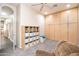 Spacious bonus room with storage and a recliner, ideal for a playroom or home office at 6920 W Tether Trl, Peoria, AZ 85383
