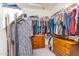 Spacious walk-in closet with custom shelves, rods, and drawers offering ample storage and organization solutions at 6920 W Tether Trl, Peoria, AZ 85383