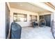 A cozy covered patio with comfortable seating and a barbecue area, great for outdoor gatherings at 6920 W Tether Trl, Peoria, AZ 85383