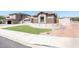 Well-maintained home with a neutral color scheme, 2-car garage, and manicured front yard at 6920 W Tether Trl, Peoria, AZ 85383