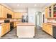 Well-equipped kitchen boasting an island, sleek appliances, and ample cabinet space at 6920 W Tether Trl, Peoria, AZ 85383